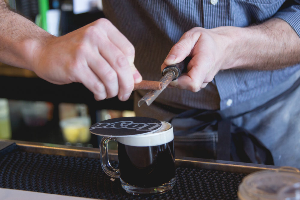 bartender garnishing coffee cocktail