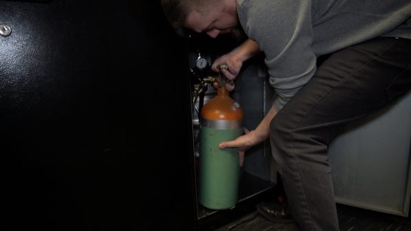 Step 10: Carefully place air tank in kegerator fridge.