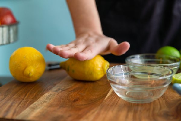 Hand rolling a lemon